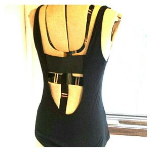 Long flow black tank with back cut out.
