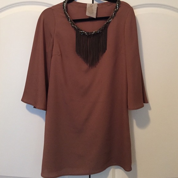 Tunic with jeweled necklace attached