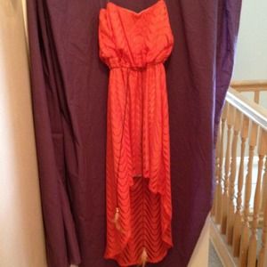 Coral dress with feathered belt