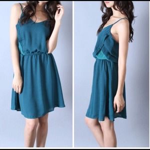 Printed crepe dress w/ blocked side and lining.
