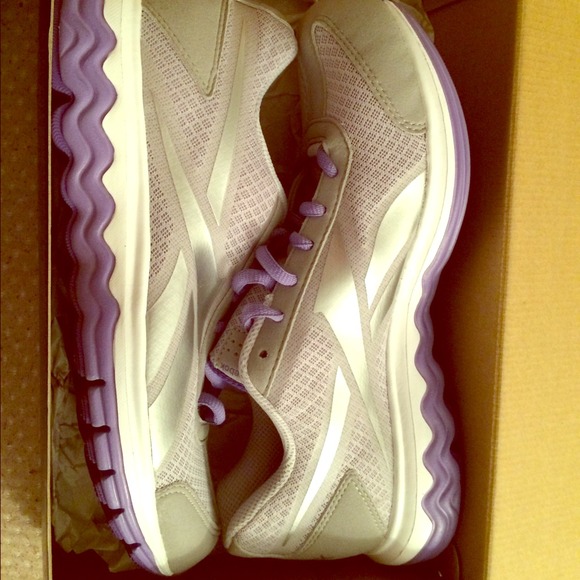 Purple and silver reebok shoes