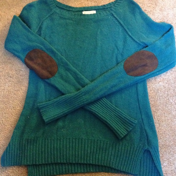 Blue sweater with brown patches on the elbows