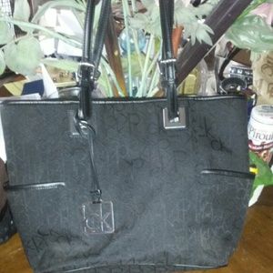 Authentic Calvin Klein signature leather trim