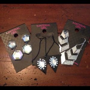 Three sparkly sets of Material girl earrings.