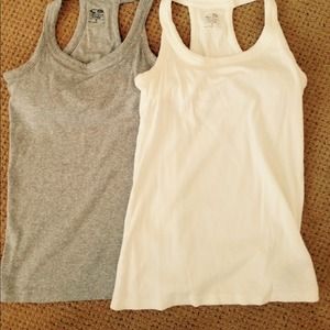 Set of two t-back tank tops with shelf bra.