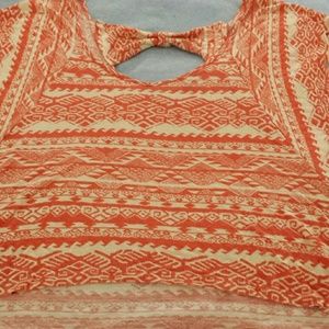 Orage and white bow back shirt