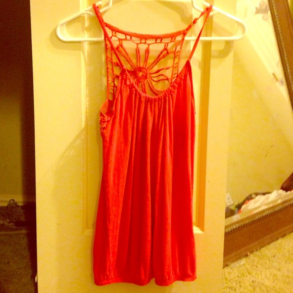 A cute tank top with a cute design in the back(: