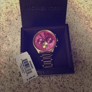 Like new Michael Kors Watch with pink face.