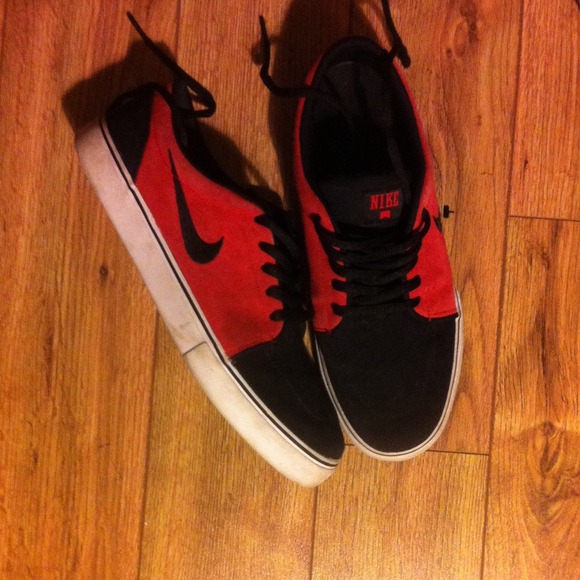 Red and black nike shoes