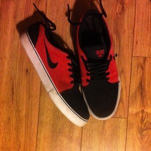 Red and black nike shoes