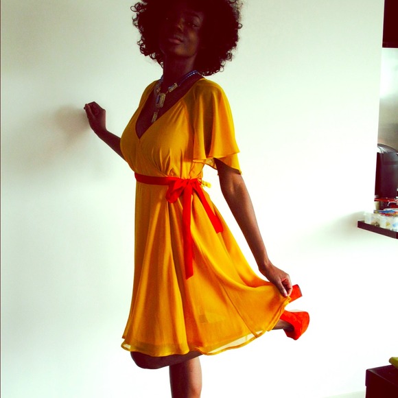 A beautiful never worn chiffon yellow dress