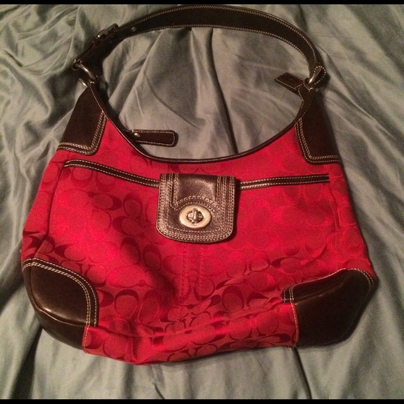 Red coach purse with brown leather accent