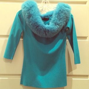 Teal top with off the shoulder faux fur.