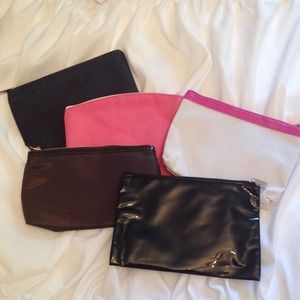 Six Ipsy cosmetic cases