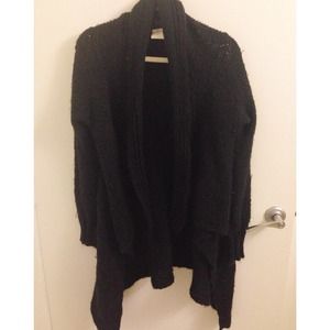 Chunky black knitted sweater with draped front