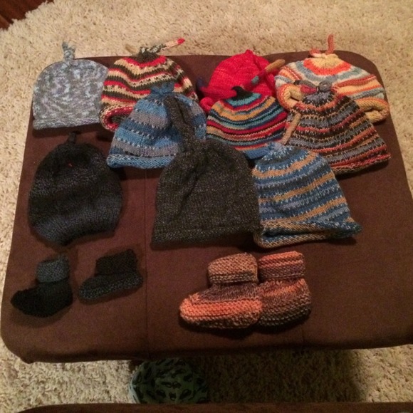 Knitted baby socks and hats. All made by me.