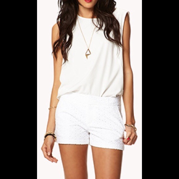 White patterned shorts with pockets.
