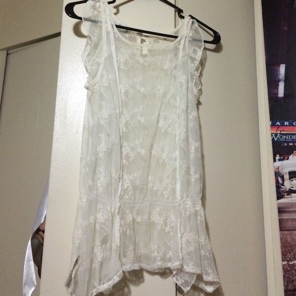 Off White Lace top with a loose peplum waist