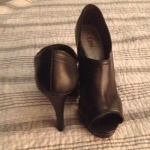 Black high heel peep toe booties.