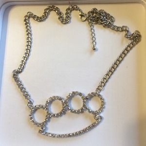 Fake diamond brass knuckles necklace