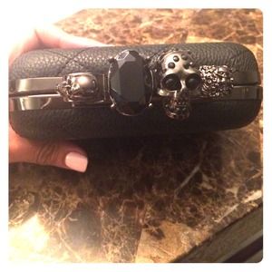 Celebrity inspired knuckle skull clutch