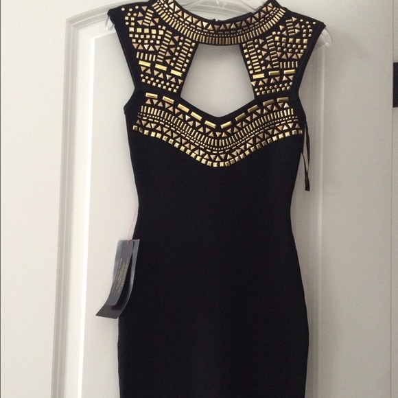 Black Bebe bodycon with gold detailing😍