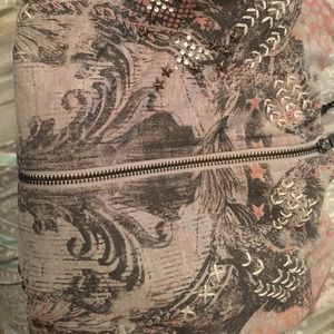 Miss me sweater XL but fits a small person