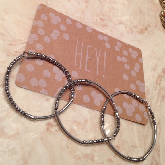 Flexible silver beaded bangles.