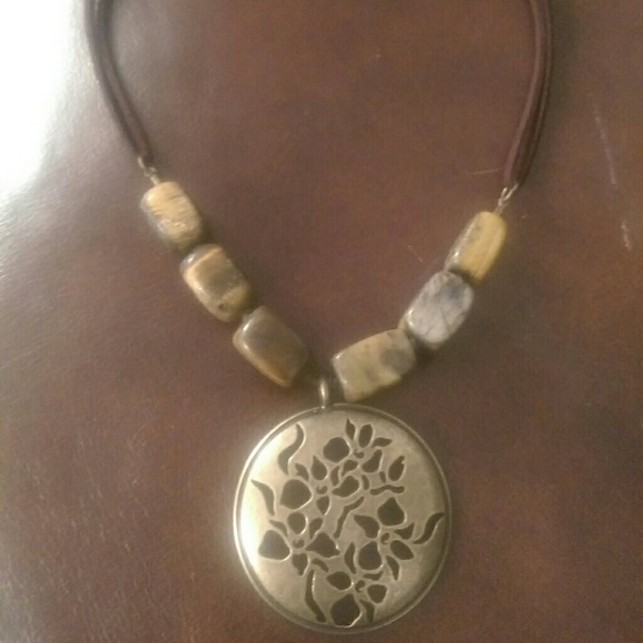 Brown necklace with bronze  center piece
