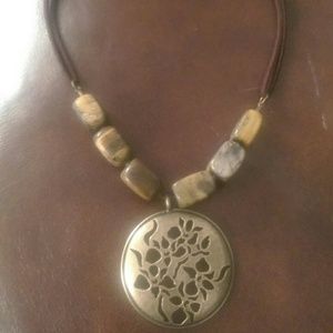 Brown necklace with bronze center piece