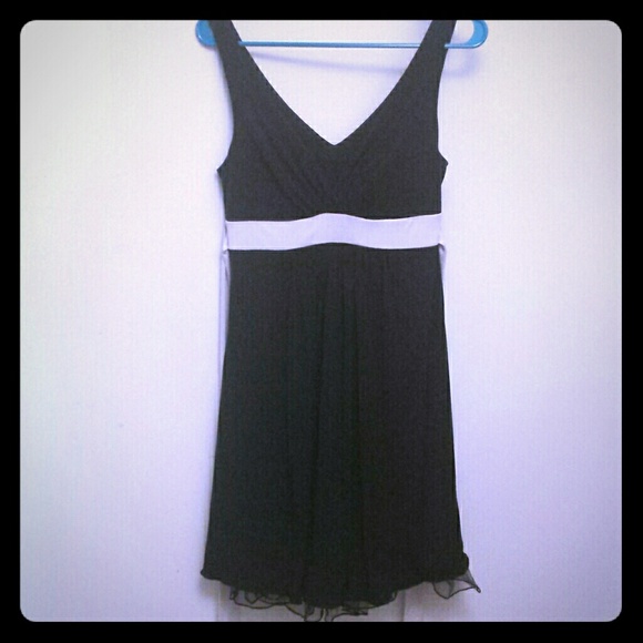 Pretty black dress with cream colored tie