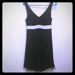 Pretty black dress with cream colored tie