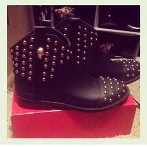 Black studded rain boots.