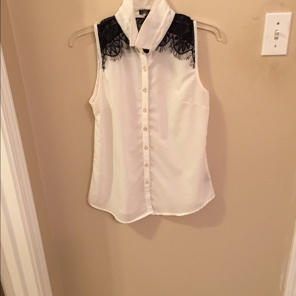 Cream sleeveless blouse