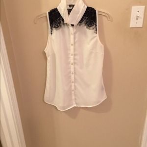 Cream sleeveless blouse