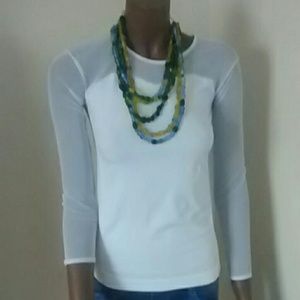 Thin white tee, blue leggings neclace