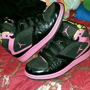 Black and hot pink Jordans
