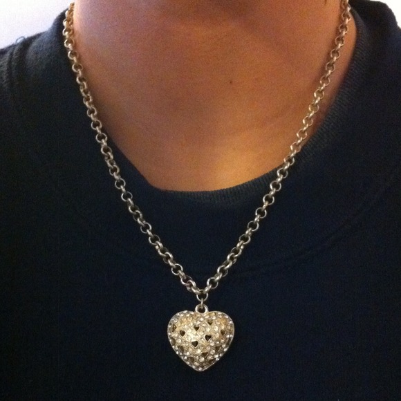 A heart shaped necklace with jewels