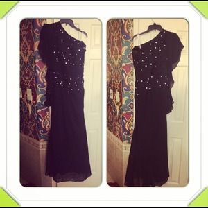 A black customized dress, never worn. SZ 12. $170