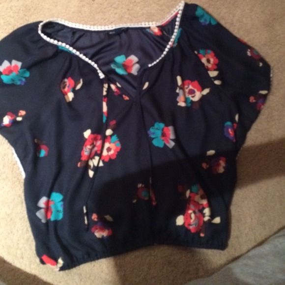 Flowery, flowing shirt.