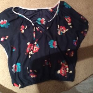 Flowery, flowing shirt.