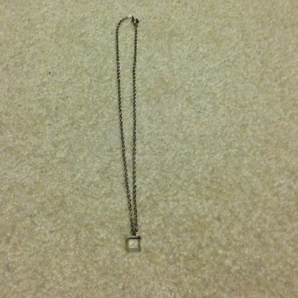 Silver necklace with clear cube pendant