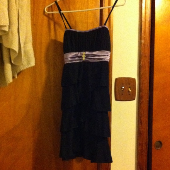Black dress. Purple strap.