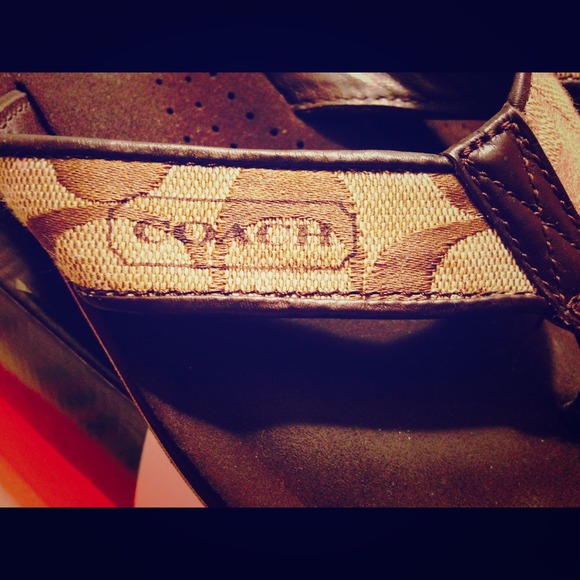 Size 5 in woman coach flip flops.