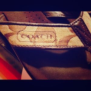 Size 5 in woman coach flip flops.