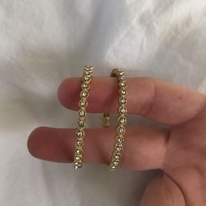 Hoop earrings with rhinestones.