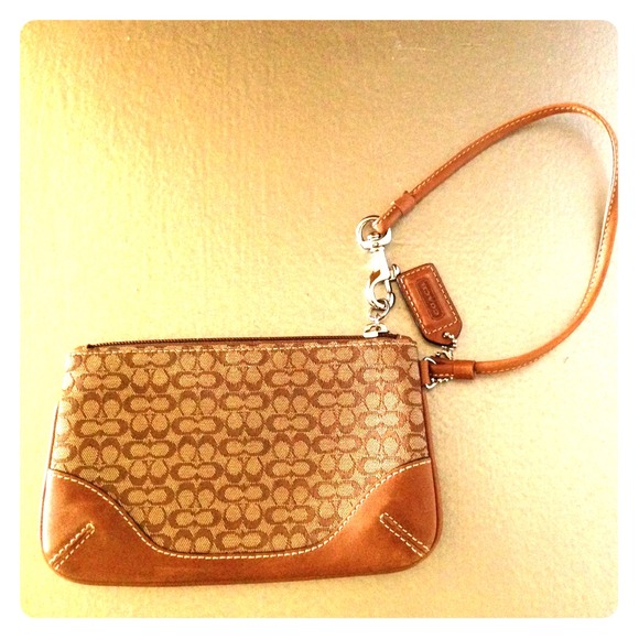 Coach leather trimmed wristlet ( gently used)