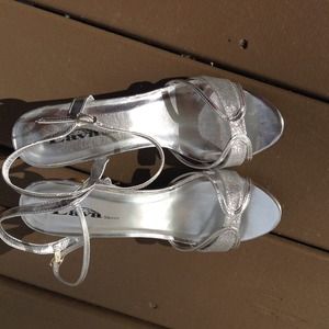 Silver strappy sandals / shoes.