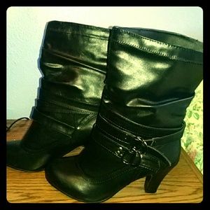 Black mid-calf boots with a small heel