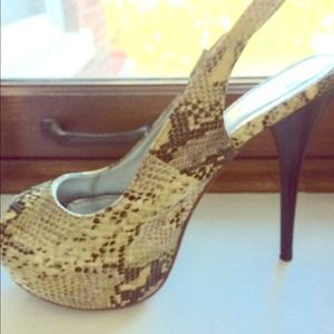 Yellow snake print open toed stiletto.